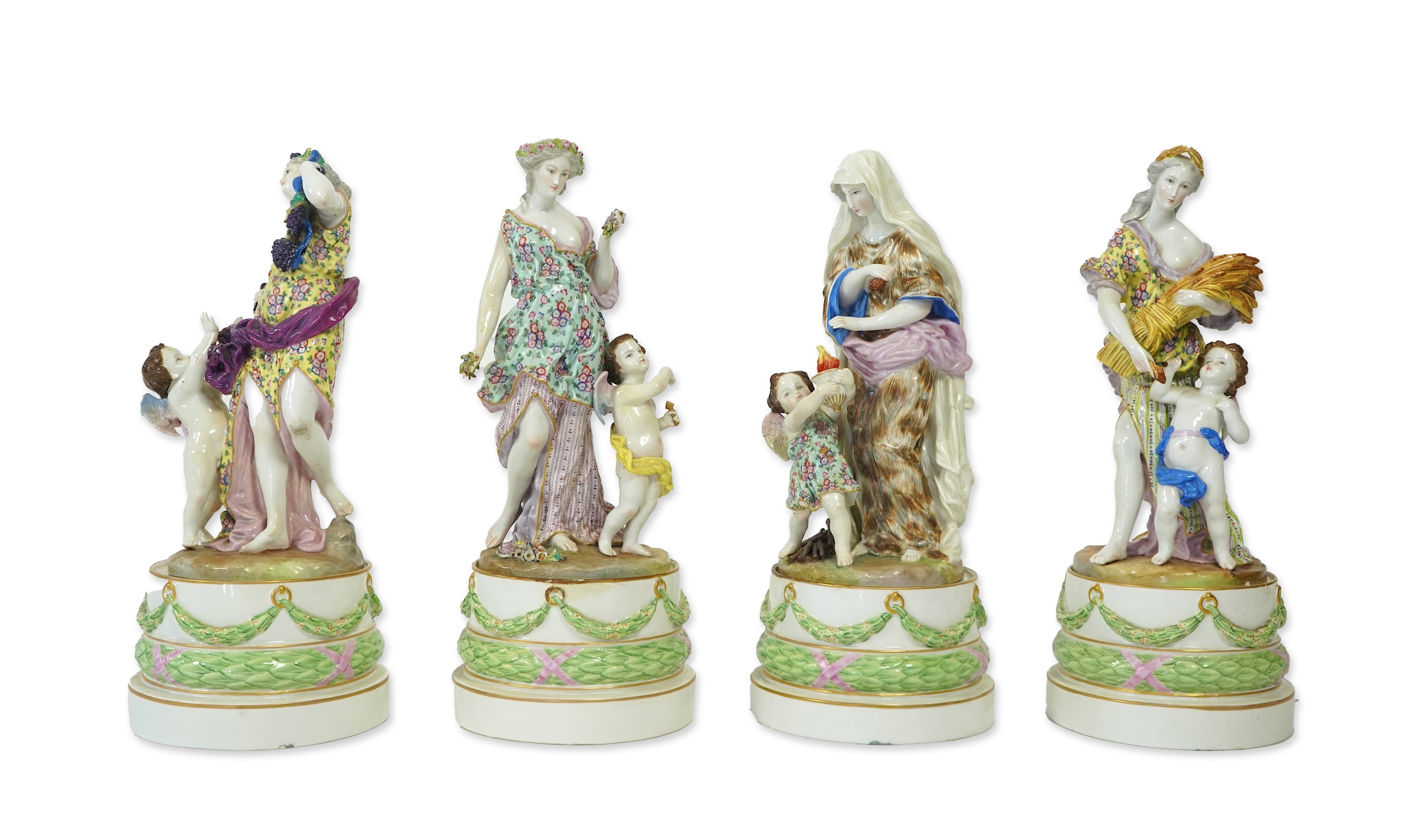 A set of four large Meissen style 'Four Seasons' groups and separate pedestals